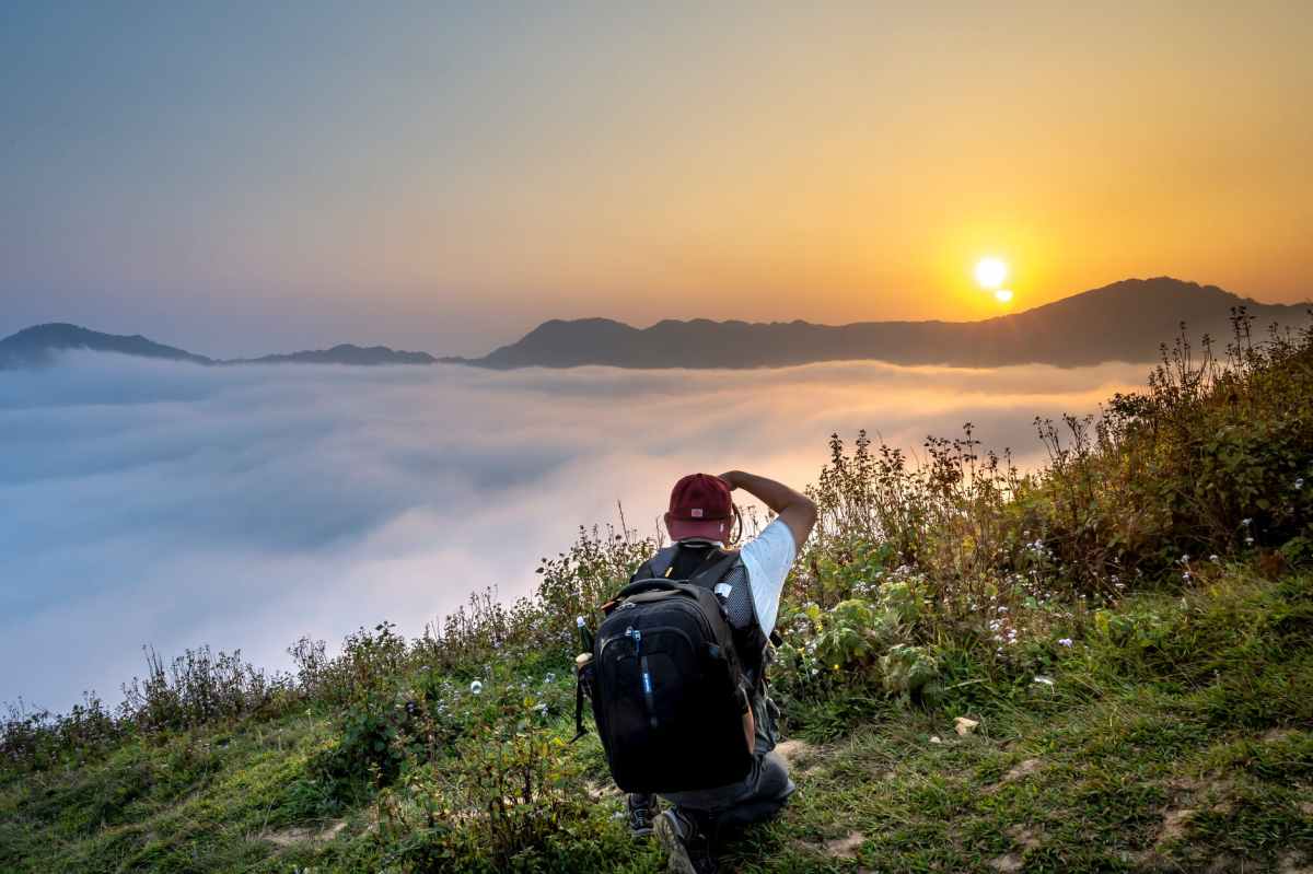 Hiker viewing sunrise: meekness