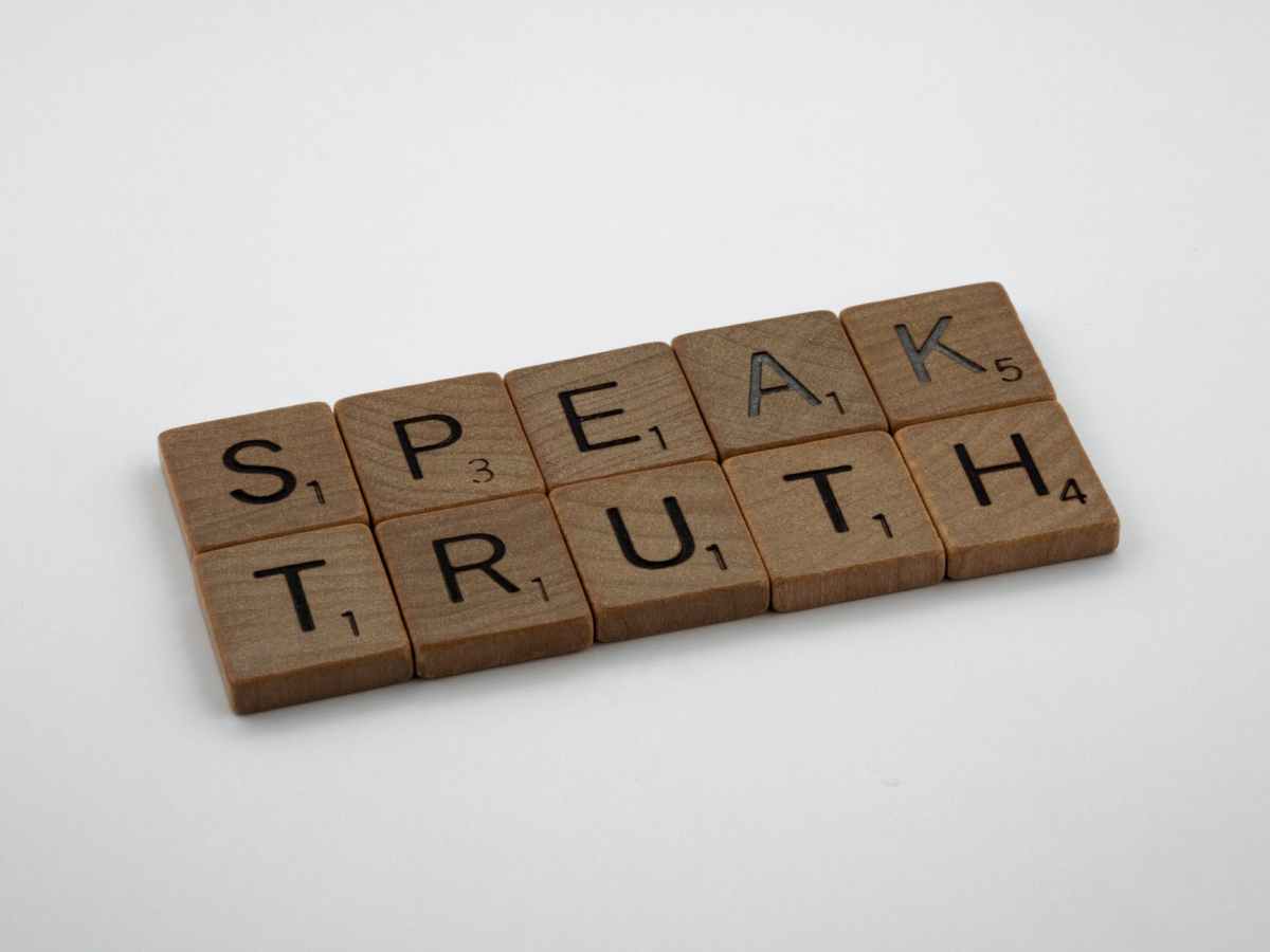 Letter tiles spelling "Speak Truth".