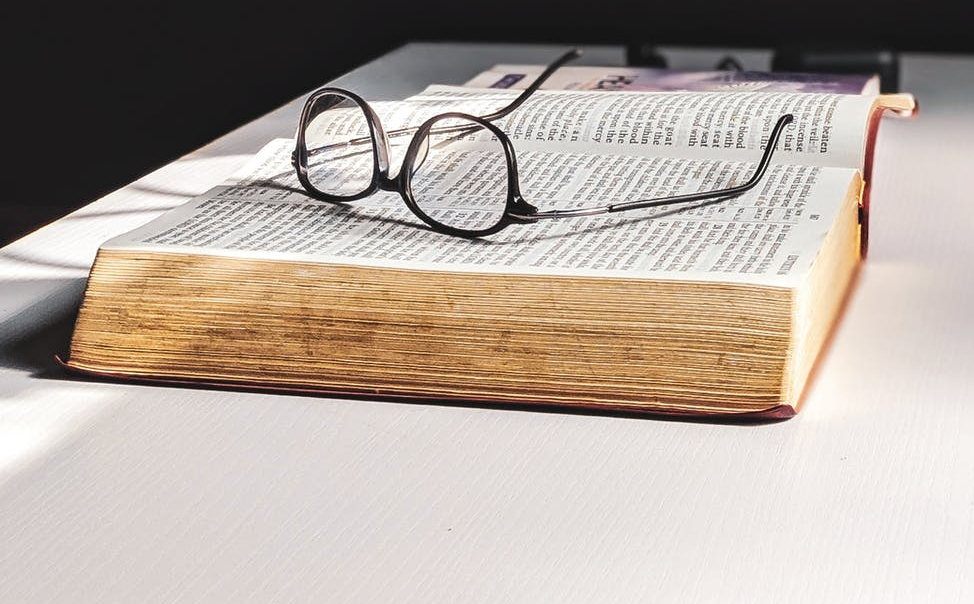 Glasses sitting atop a Bible: how the pandemic improved my sight