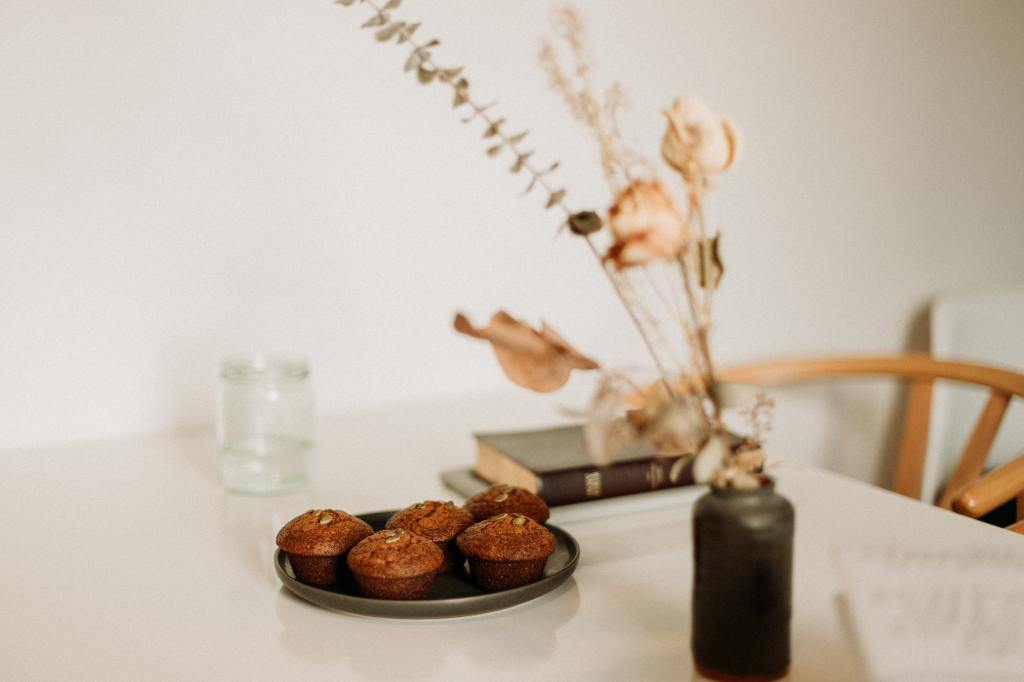 Plate of muffins next to a Bible: How to Repay an Outrageous Act of Kindness - Feel Free to Start with These Muffins!